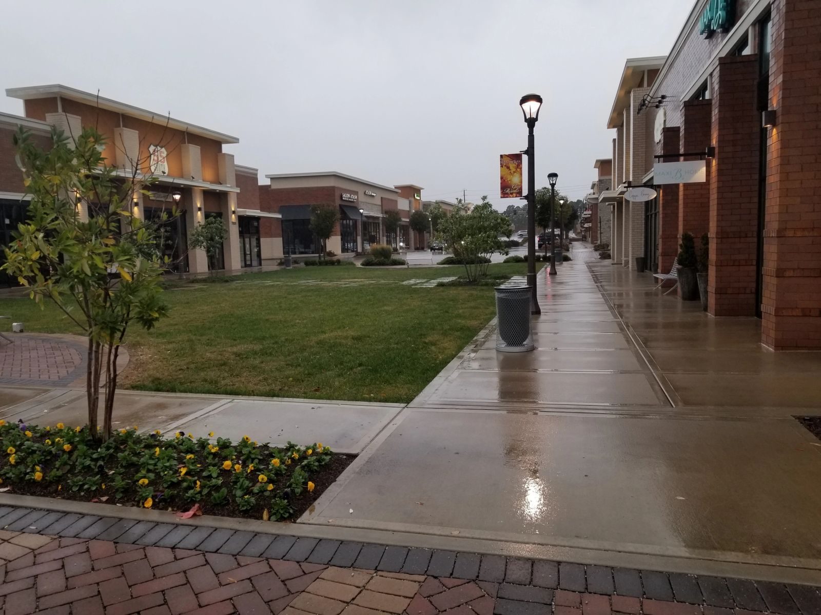 Clean sidewalks and storefronts at a Brentwood retail center after pressure washing