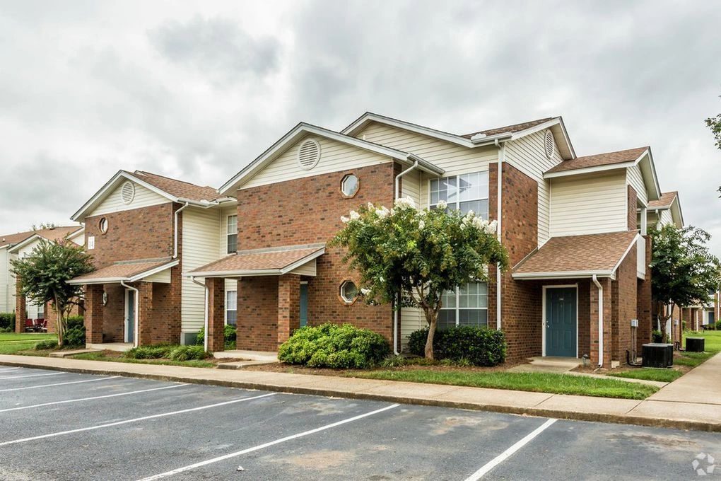 Brick townhome community with clean parking lot
