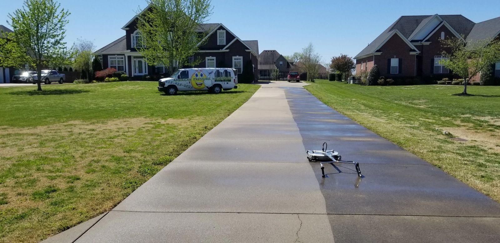 Long concrete driveway in Brentwood TN right after pressure washing