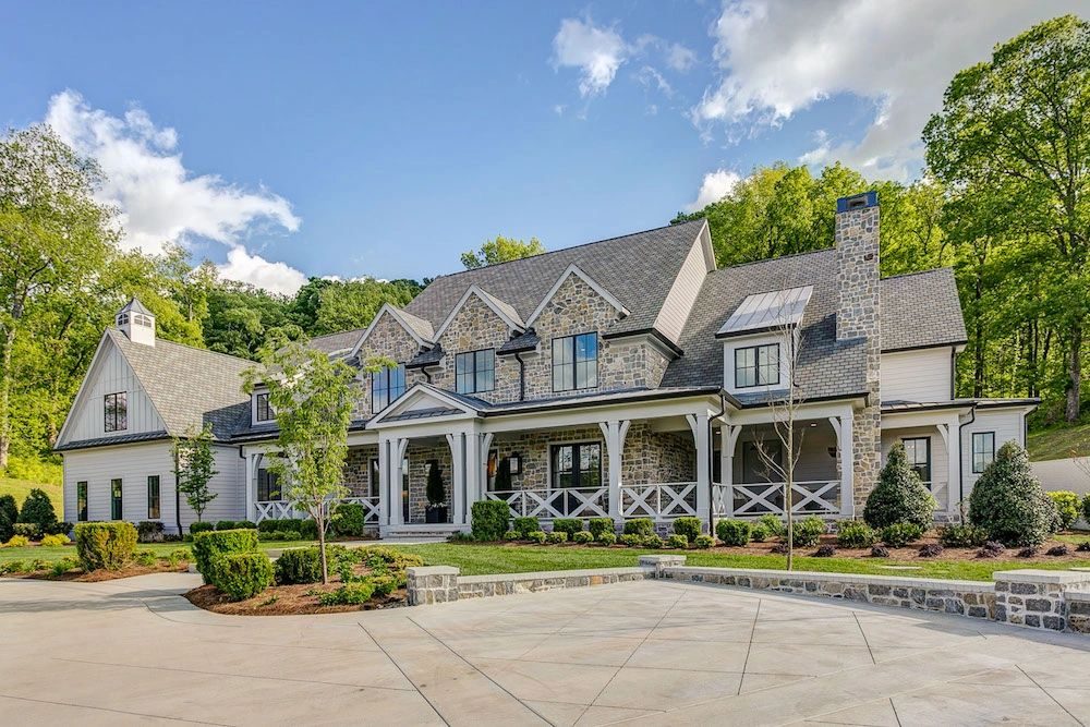 Stone and brick home with a clean driveway and walkway in Franklin TN