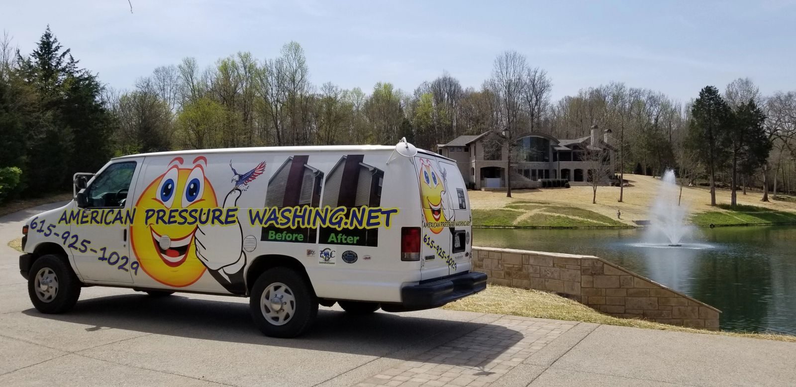 American Pressure Washing truck parked beside a pond and fountain in a Brentwood neighborhood